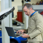 mechanic with laptop